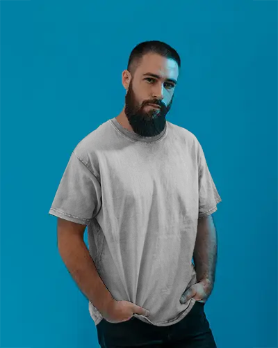 Relaxed Fit Tshirt Mockup On Bearded Man Simple Pose Minimal Scene With Bold Color