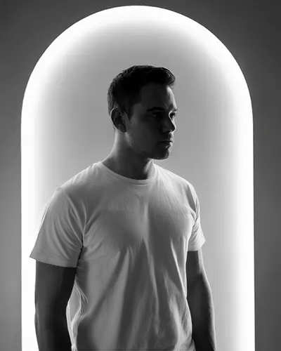 cinematic-portrait-t-shirt-mockup-strong-shadows-and-soft-backlight-glow