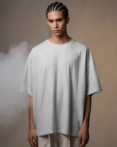 oversized-tshirt-mockup-male-model-braided-hair-soft-smoky-background-streetwear-fashion-vibe