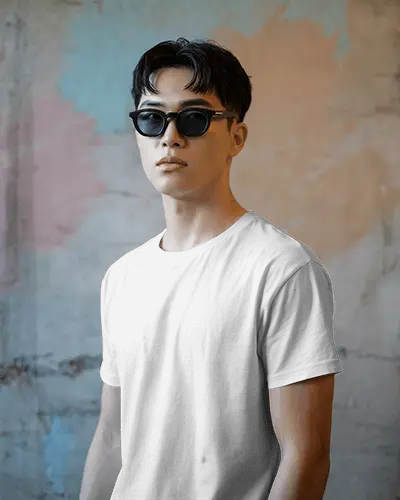 urban-style-t-shirt-mockup-male-model-wearing-sunglasses-against-textured-wall-in-soft-lighting
