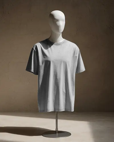 minimal-display-t-shirt-mockup-on-mannequin-stand-with-dramatic-shadows-in-neutral-modern-interior