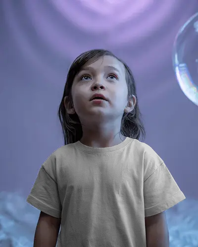 dreamy-kid-t-shirt-mockup-child-looking-up-in-purple-light-bubbles-magical-playful-style