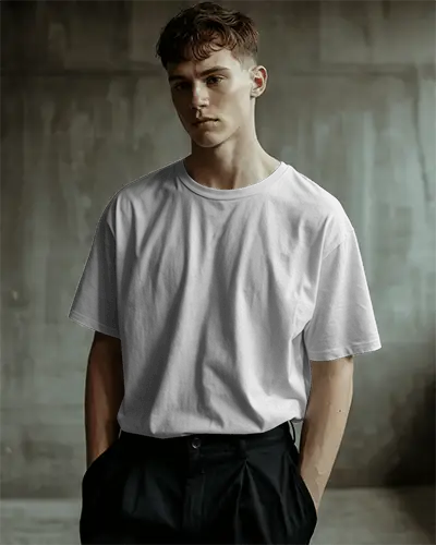 urban-studio-t-shirt-mockup-male-model-standing-in-industrial-setting-minimal-edgy-modern-look