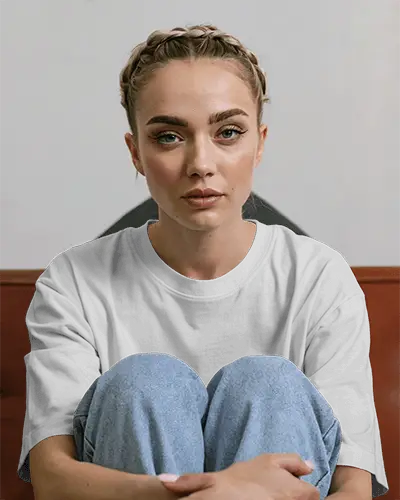 Seated Cozy T Shirt Mockup Female Model Knees Up Casual Denim Streetwear Soft Expression