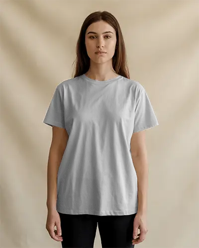 Neutral T Shirt Mockup Female Model Front View Soft Lighting Against Beige Backdrop