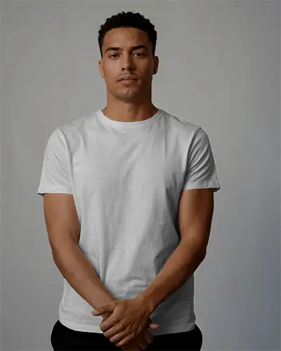 Confident T Shirt Mockup Male Model Front View Hands Folded In Simple Studio Background