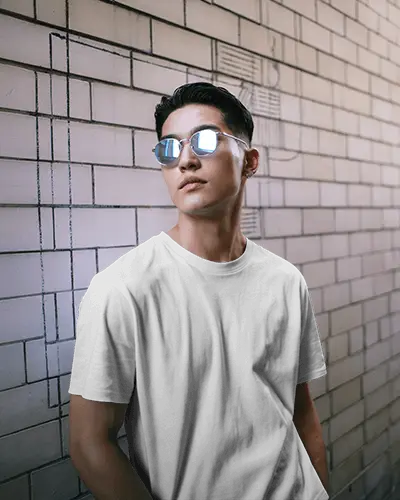 Urban Street Tshirt Mockup Male Model Wearing Sunglasses Against Modern Brick Wall Background