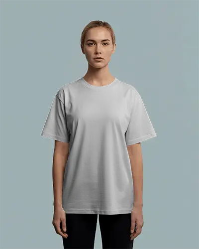 Minimal T Shirt Mockup Female Model Front Facing Straight Pose Soft Blue Studio Background