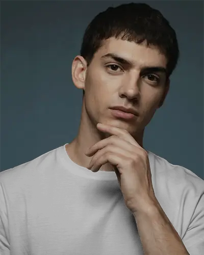 Casual Pose T Shirt Mockup With Hand Near Chin Soft Studio Lighting Clean Modern Vibe