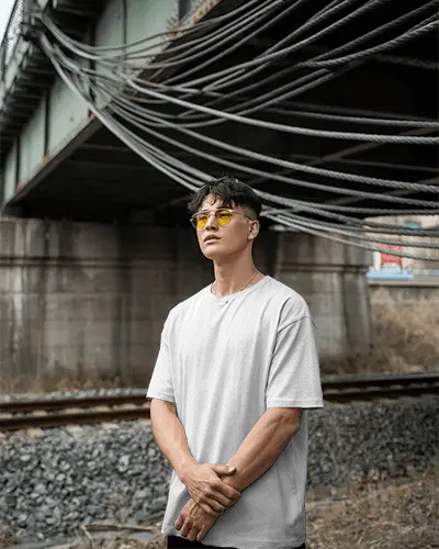 trendy-youth-outfit-plain-tshirt-mockup-model-posing-background-industrial-vintage-look