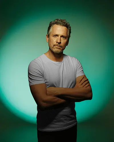 Confident Male T Shirt Mockup Mature Man Posing With Crossed Arms In Studio Colored Light