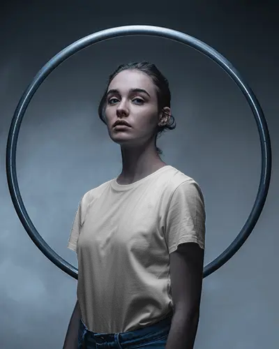 Fashion Portrait T Shirt Mockup Female Model With Metal Ring Backdrop In Studio Soft Lighting
