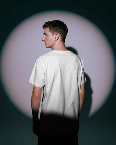 Spotlight Back View Tshirt Mockup Male Model In Studio Dramatic Lighting Modern Fashion Style