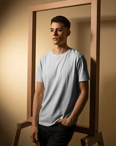Wooden Frame Studio Tshirt Mockup Male Model Posing Confident Look Warm Lighting Modern Style