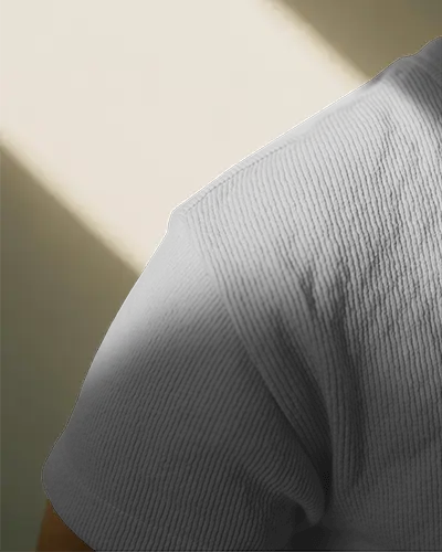 Closeup Shoulder Tshirt Mockup Fabric Texture Detailed Stitching Soft Light Minimal Studio Shot