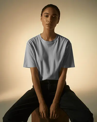 Seated Female Tshirt Mockup Natural Lighting Soft Expression Minimal Studio Clean Backdrop