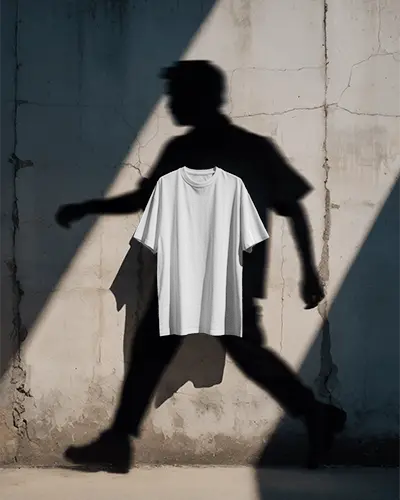 Creative Shadow Tshirt Mockup Floating Tee Against Concrete Wall With Human Silhouette