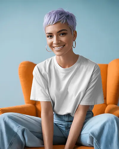 Lifestyle Tshirt Mockup Smiling Female Model In Orange Chair With Casual Modern Vibes