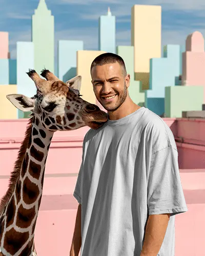 Lifestyle Tshirt Mockup Male Model With Giraffe In Colorful Cityscape Playful Setting