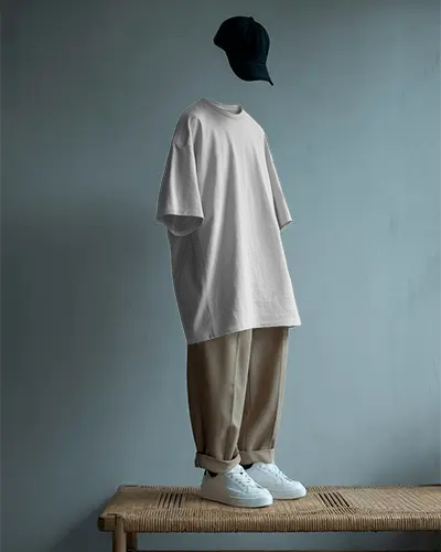 Floating Outfit Tshirt Mockup With Cap And Loose Trousers Minimal Studio Display