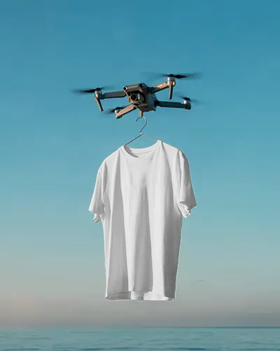 Drone Hanging Tshirt Mockup Over Ocean Background In Clear Blue Sky Minimal Style