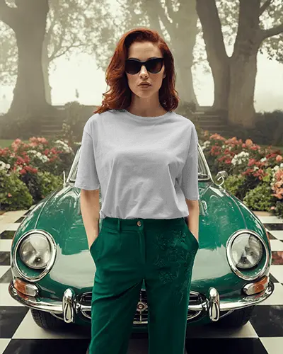 Vintage Car Tshirt Mockup Female Model Standing In Front Of Classic Auto In Garden Driveway
