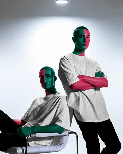 Avantgarde Colorwash Tshirt Mockup Featuring Two Models Under Artistic Spotlight