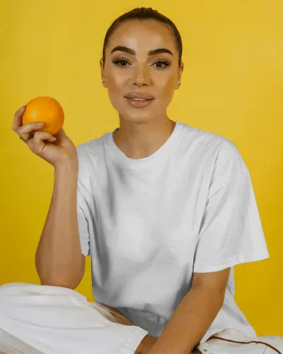 Casual Loose Fit Womens Tshirt Mockup With Natural Posing On Bright Background