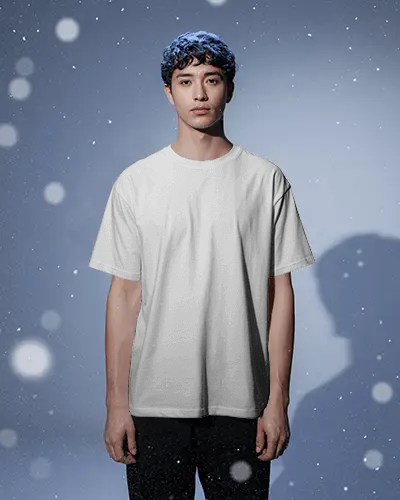 Christmas Tshirt Mockup Male Model Standing In Snowy Festive Background Soft Winter Lighting
