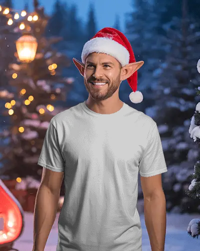 Christmas Tshirt Mockup Male Elf In Santa Hat Smiling In Snowy Festive Winter Setting