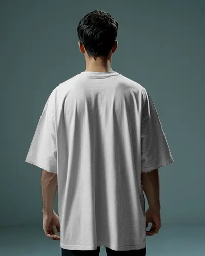 Oversized Back View T Shirt Mockup Male Model In Cool Muted Studio Light Teal Toned Setting