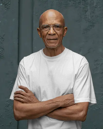 Tshirt Mockup Senior Male Model Arms Crossed Minimal Studio Portrait Neutral Background