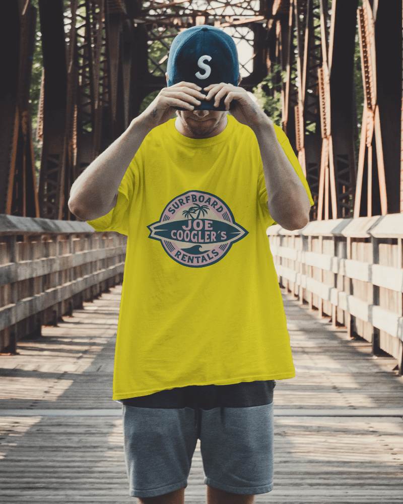 Young Man Tshirt Mockup With Hands On Cap Looking Down Standing On Bridge