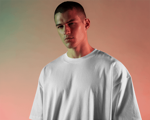 Cool Toned Gradient Background Mockup Front View Of Blank Oversized T Shirt On Male Model Standing With Serious Contemplative Expression Against Subtle Gradient Setting Modern Mood
