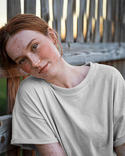 Outdoor Relaxed Portrait T Shirt Mockup Close Up Female Model Leaning Against Wooden Fence Soft Natural Light