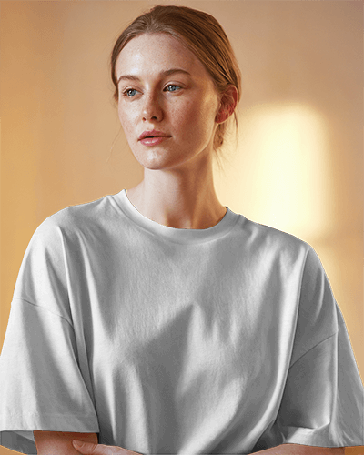 Warm Light T Shirt Mockup Indoors Female Model With Serene Expression And Soft Lighting Perfect For Lifestyle Designs