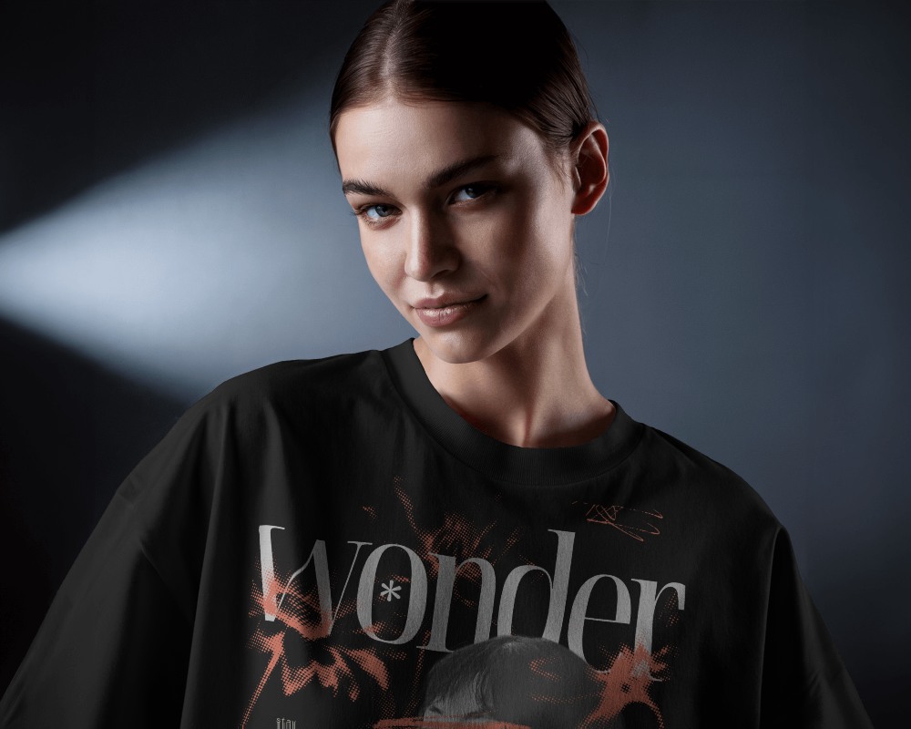 Focused Light T Shirt Mockup Female Model Smirking Under Soft Backlight