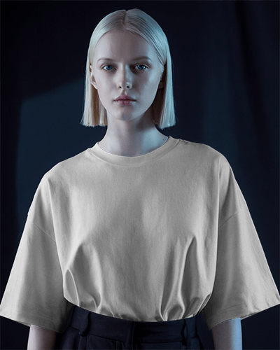Moody Light T Shirt Mockup Blonde Model Staring With Soft Shadowed Blue Light