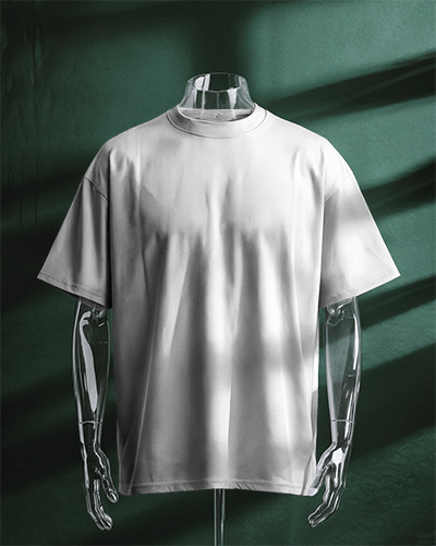 Artistic Display T Shirt Mockup On Glass Mannequin With Dappled Natural Light Green Background
