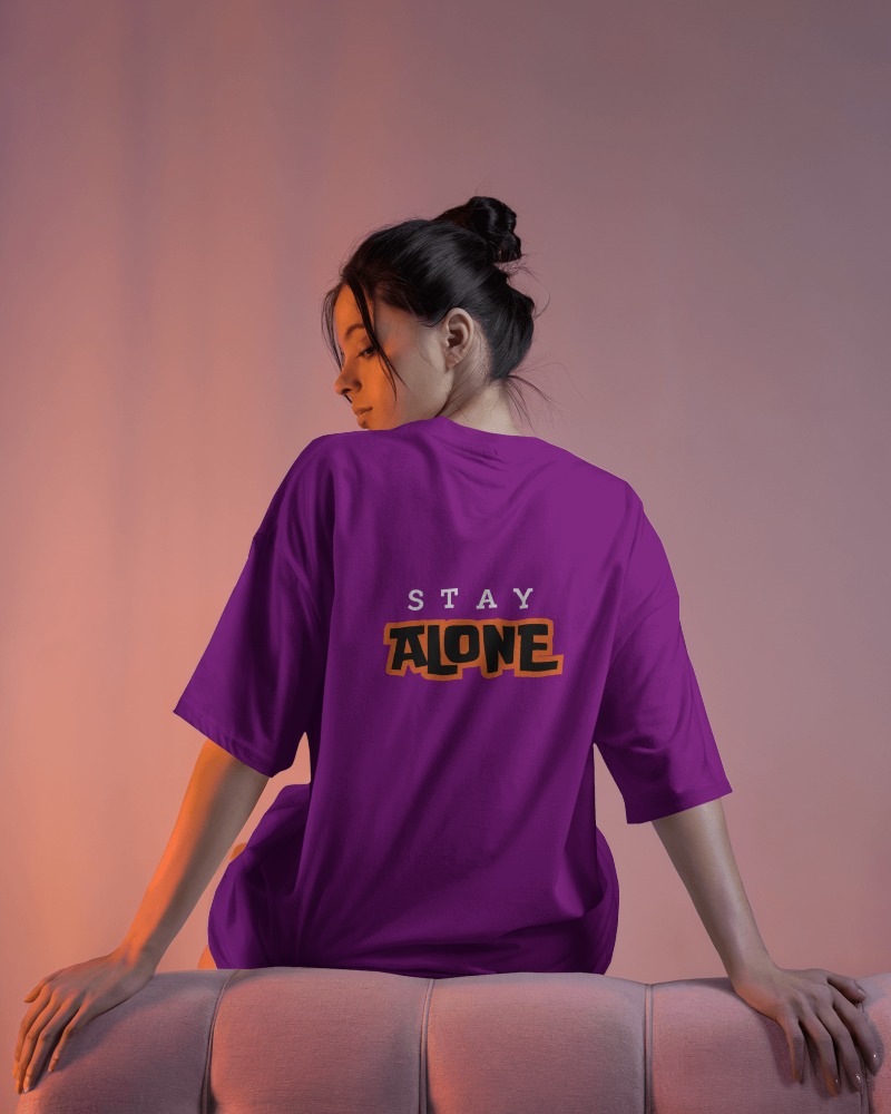 Back View T Shirt Mockup Female Model Posing On Pink Couch In Soft Purple Gradient Lighting
