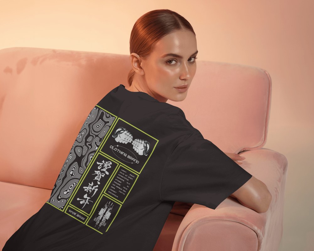 Back View T Shirt Mockup Female Model On Pink Sofa With Soft Warm Lighting And Casual Pose