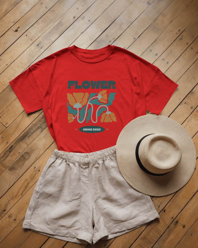 Flat Lay T Shirt Mockup On Wooden Floor With Summer Outfit Including Shorts And Straw Hat