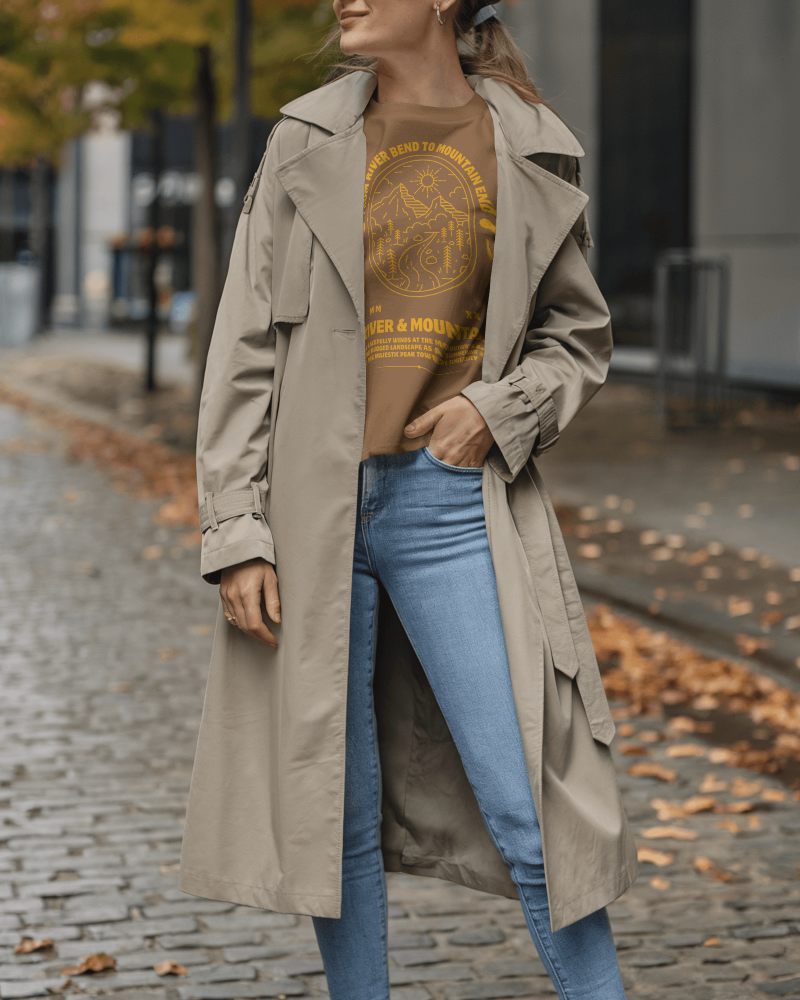 Autumn Street T Shirt Mockup Female Model In Trench Coat With Casual Pose And Fallen Leaves Background