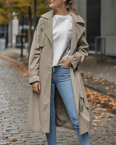 Autumn Street T Shirt Mockup Female Model In Trench Coat With Casual Pose And Fallen Leaves Background