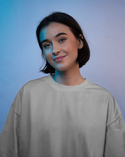 Moody Portrait T Shirt Mockup Female Model Smiling In Subtle Blue Lighting