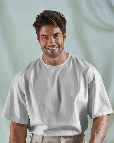 Smiling Male Model T Shirt Mockup Relaxed Fit Soft Draped Fabric Light Background Casual And Confident Look 0652