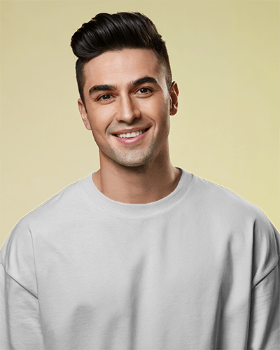 Clean Casual T Shirt Mockup Male Model Smiling In Soft Yellow Lighting Modern And Approachable Style 0674