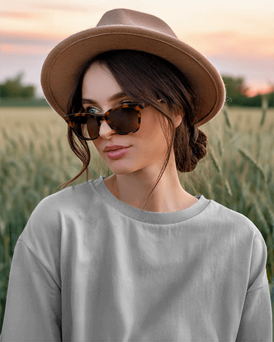 Boho Chic T Shirt Mockup Female Model With Hat And Sunglasses Rustic Field Sunset Warm Earthy Aesthetic 0678