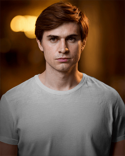 Moody Male Model T Shirt Mockup Warm Bokeh Background Soft Lighting Minimalist Aesthetic 0684