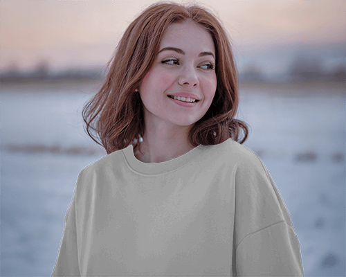 Sunset Winter T Shirt Mockup Female Model Smiling In Soft Cold Breeze Cozy And Serene Outdoor Atmosphere 0700